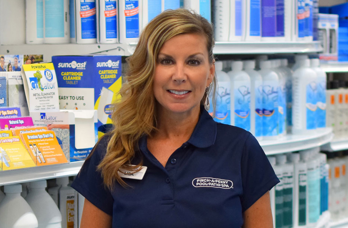 female employee standing in Pinch A Penny store uniforms.