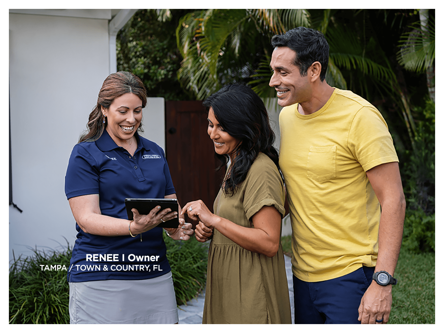 2. Franchise owner speaking with two customers outside a Pinch A Penny store.