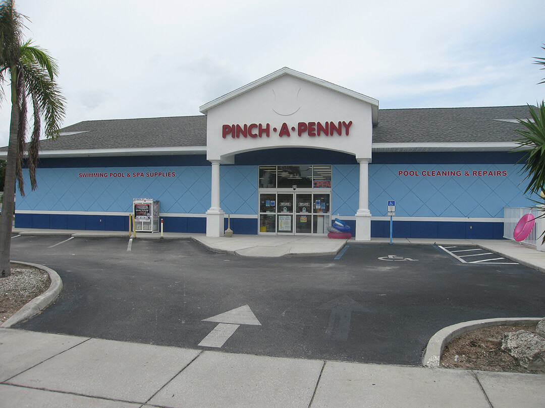 Exterior photo of Pinch A Penny storefront with signage.