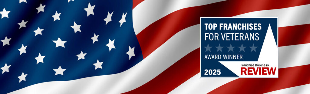 An American flag waves in the background beside a blue and white badge that reads “Top Franchises for Veterans Satisfaction Award 2025” from Franchise Business Review.