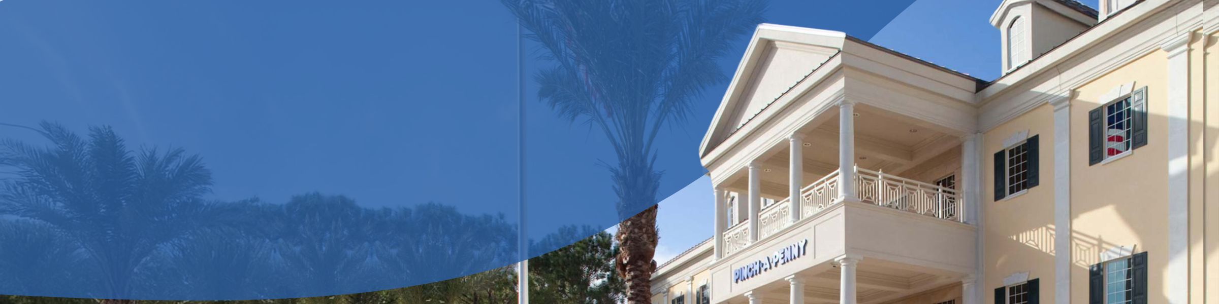 Exterior of Pinch A Penny building with palm trees and blue curved overlay, no people